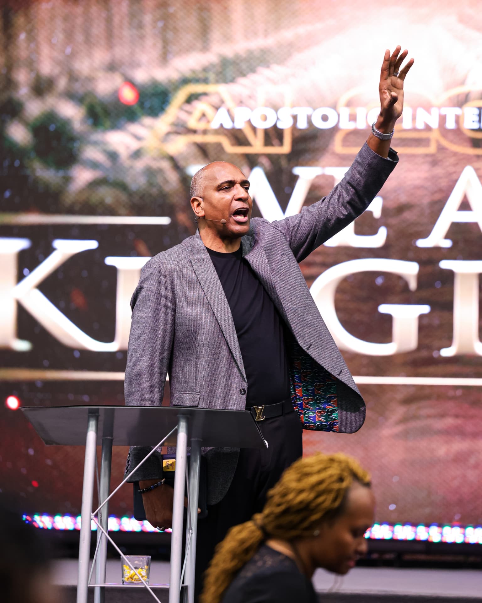 A minister preaching with a raised hand at the AI 2027 stage